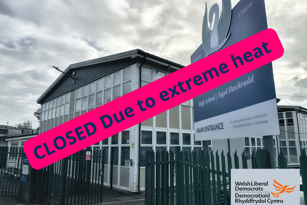 A picture of Bedwas High school with a banner across the image saying closed due to extreme heat.