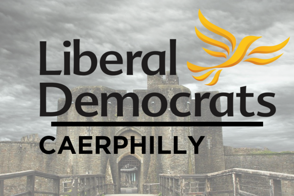 An image of Caerphilly Castle. The image also shows the Liberal Democrat logo (A Flying Bird) and the words Liberal Democrats, Caerphilly.